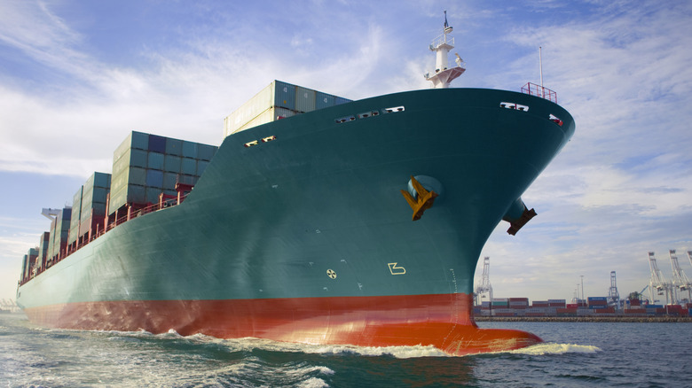 A large container ship cruising near port.