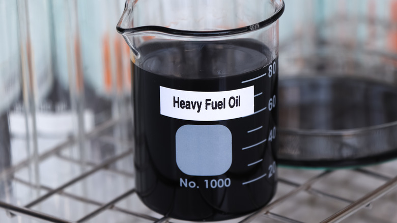 Heavy fuel oil in a laboratory container.