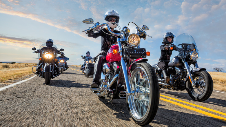 Motorcyclist riding cruiser bikes on the road