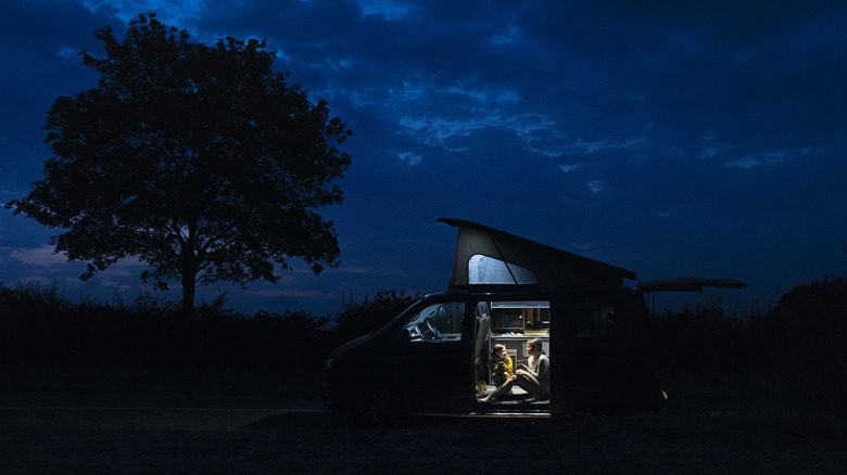 An RV Parked In A Campsite With No Exterior Or Surrounding Lights