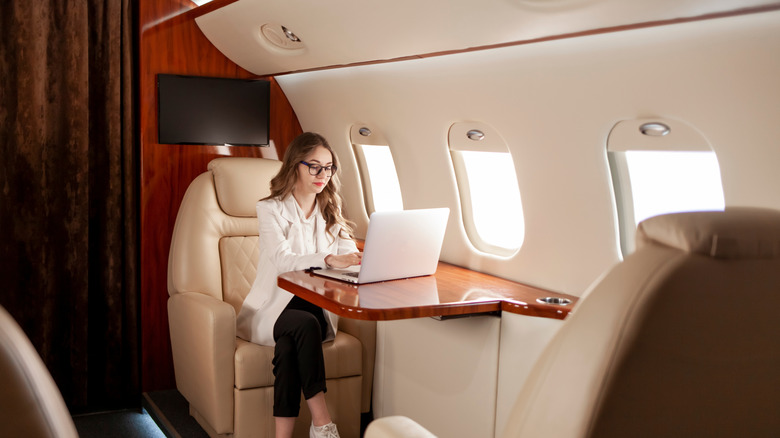 Woman working on a private jet