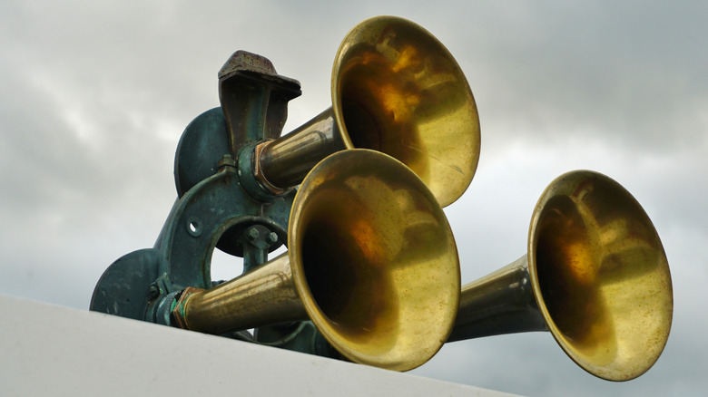 Air horns affixed to the top of a ship