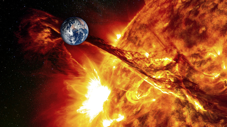 illustration of Earth in path of solar flare