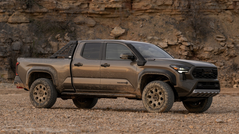 A brown Toyota Tacoma Trailhunter with an air intake snorkel on the passnenger side