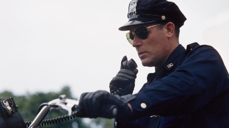 A motorcycle-riding police officer