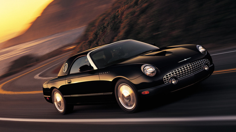 Black Ford Thunderbird driving