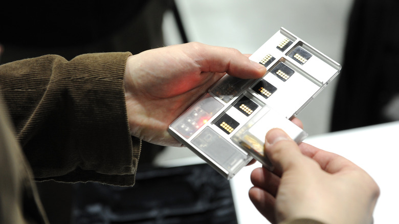 Man using a modular smartphone.