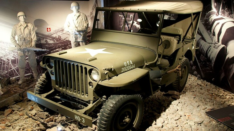 A green 1941 Willy's Jeep on display.