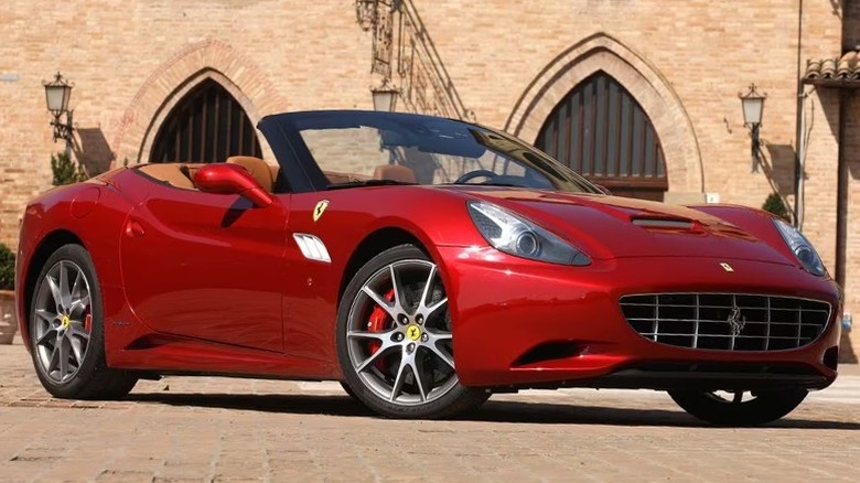 Red 2012 Ferrari California 30 in front of a building.