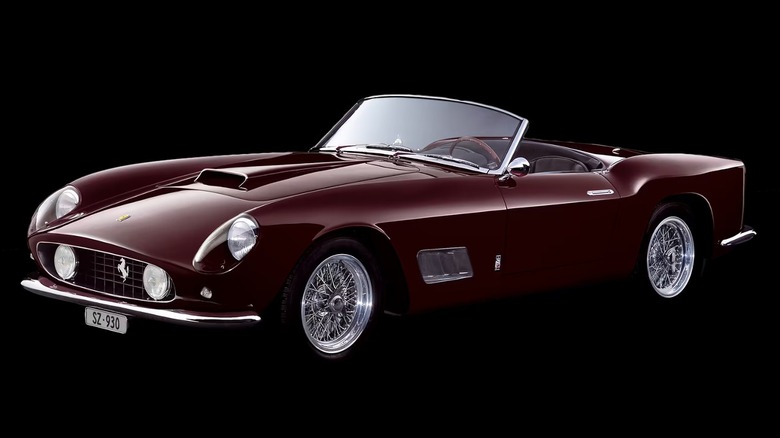 Dark burgundy 1957 Ferrari 250 California convertible with the top down.