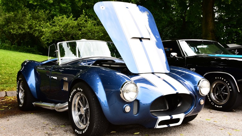 A bright blue and white 427 powered Shelby Cobra on display