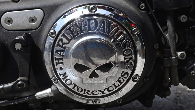 Metallic badge of Harley Davidson Motorcycles with skull.