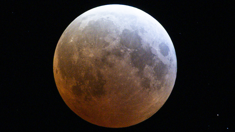 A full moon with a reddish tint.