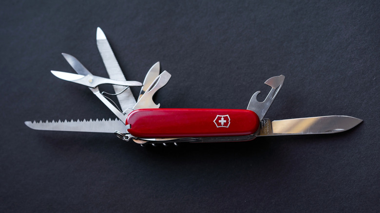 Traditional red Swiss Army Knife with tools exposed