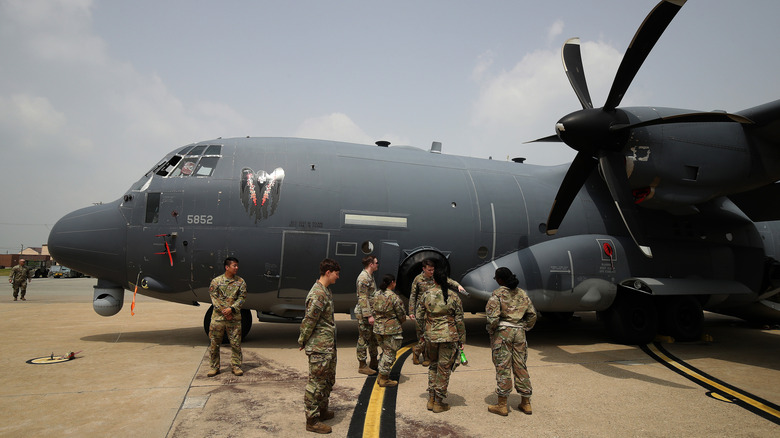 AC-130 gunship and personnel