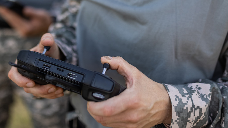 Soldier holding drone controller