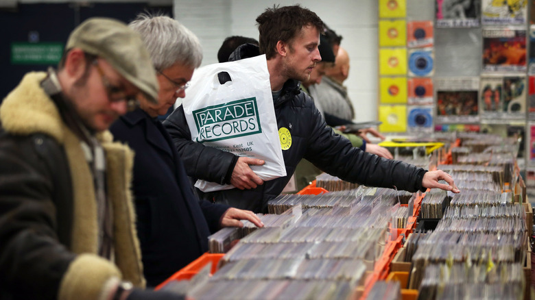 men shopping at a record fair in London, England