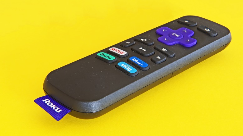 Roku remote on yellow backdrop