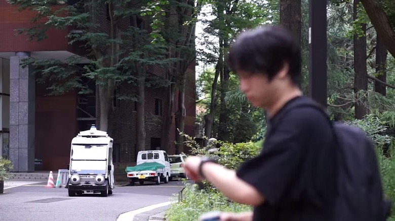 car approaching pedestrian at crosswalk