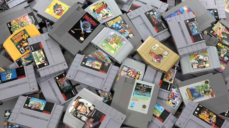 Pile of NES, SNES, and Nintendo 64 cartridges