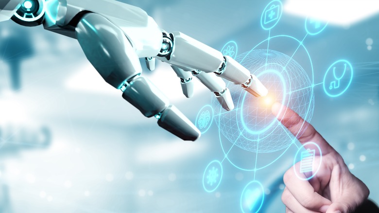 AI robot touching human finger