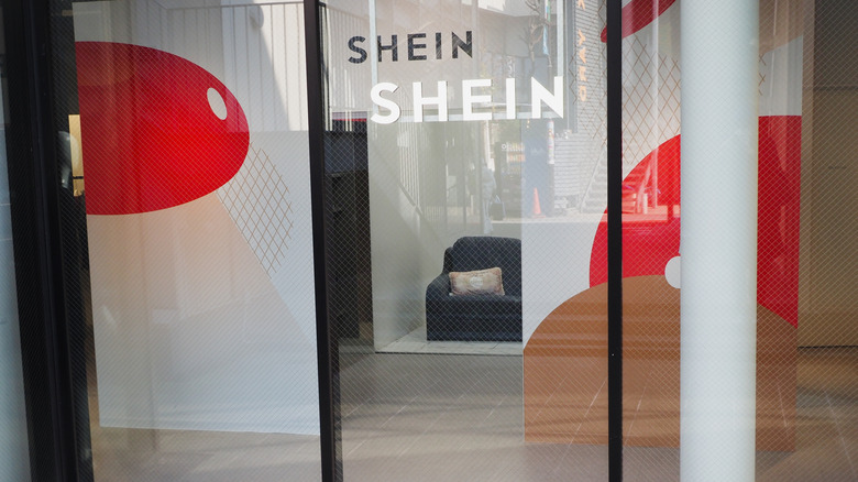 SHEIN logo on glass storefront door