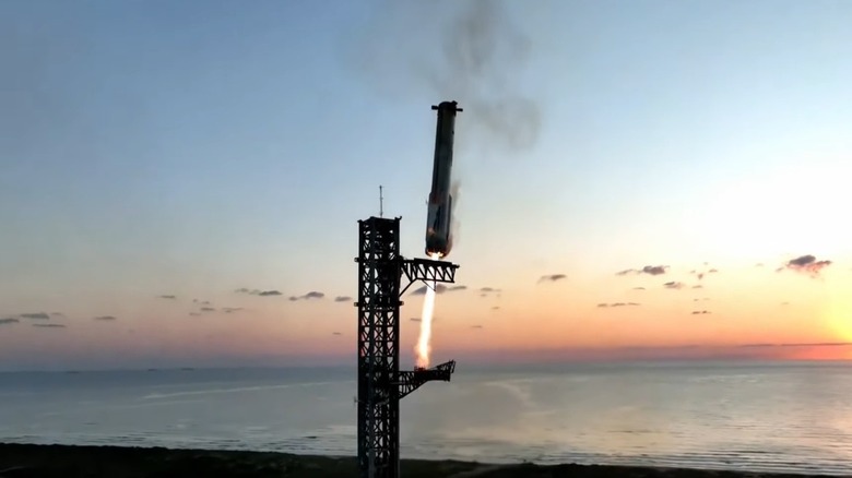 Space X Super Heavy booster caught by chopsticks