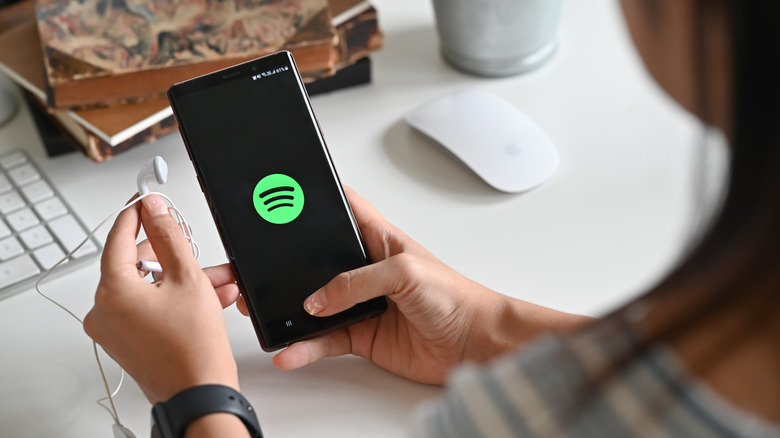 person using Spotify on Samsung phone