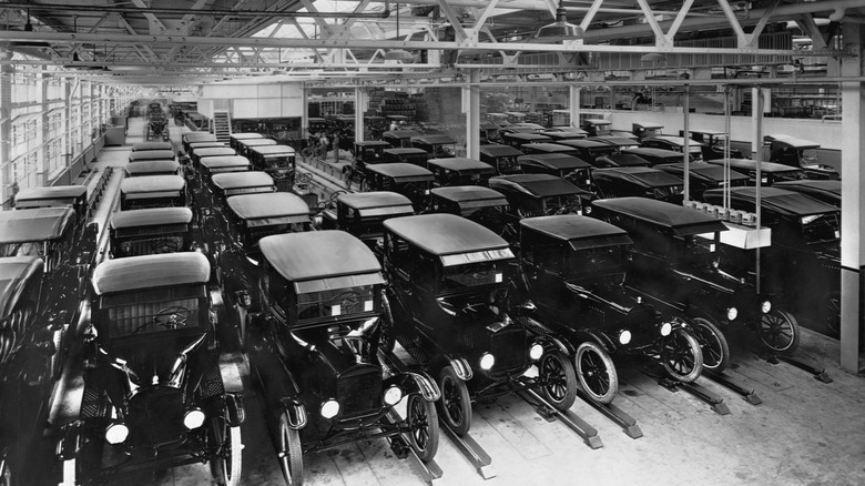 Ford Model T's (all black) waiting for delivery after leaving assemply line in 1925.