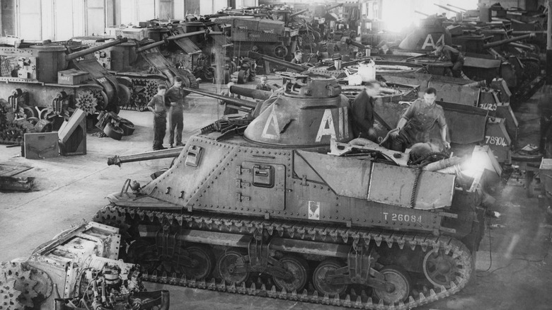 Mechanics working on M3 tanks