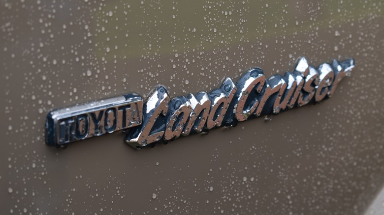 Toyota Land Cruiser emblem on the side of a vehicle.