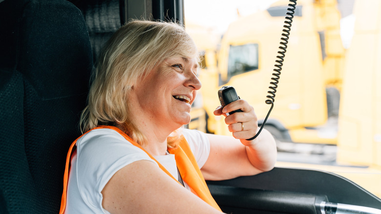 Woman truck driver talking on CB radio