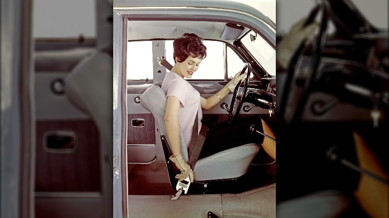 Woman buckles three-point safety belt