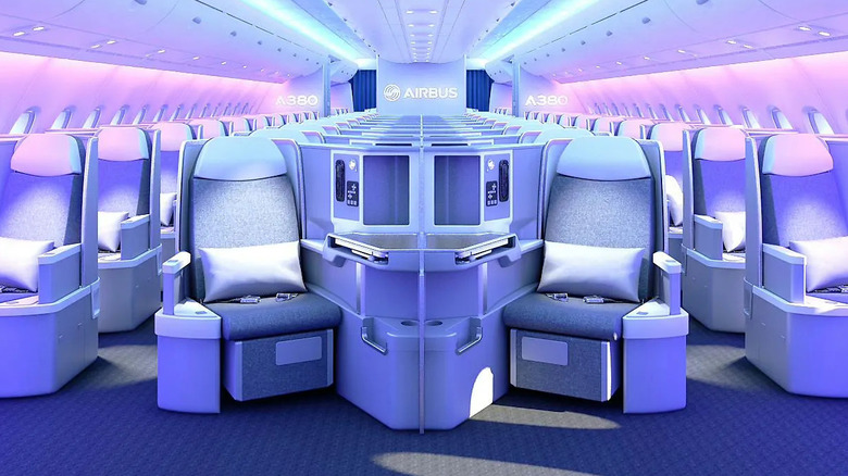 The interior of the Airbus A380 glows purple, showcasing the plane's luxury seating