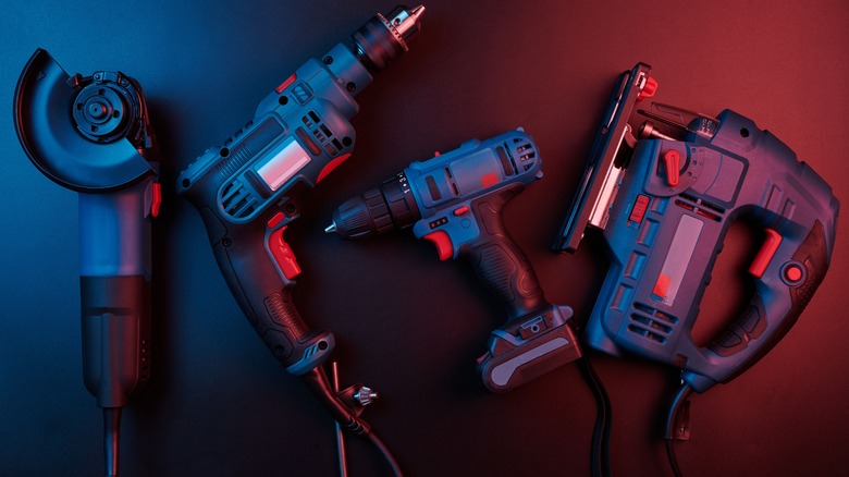 Blue power tools on a dark background