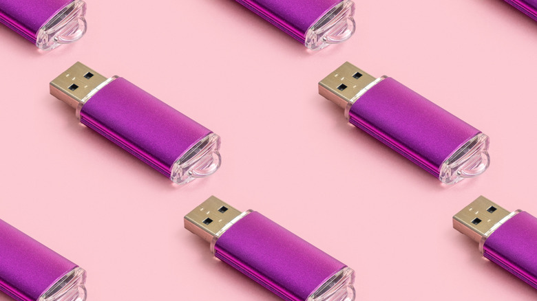 Purple flash drives arranged in a pattern