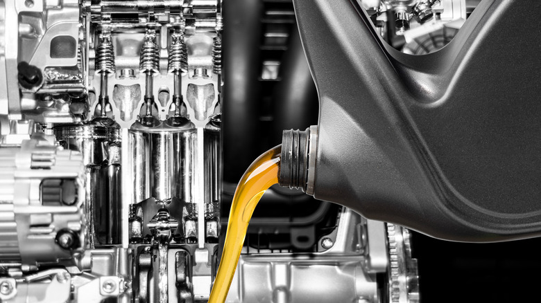 Fresh engine oil with engine background