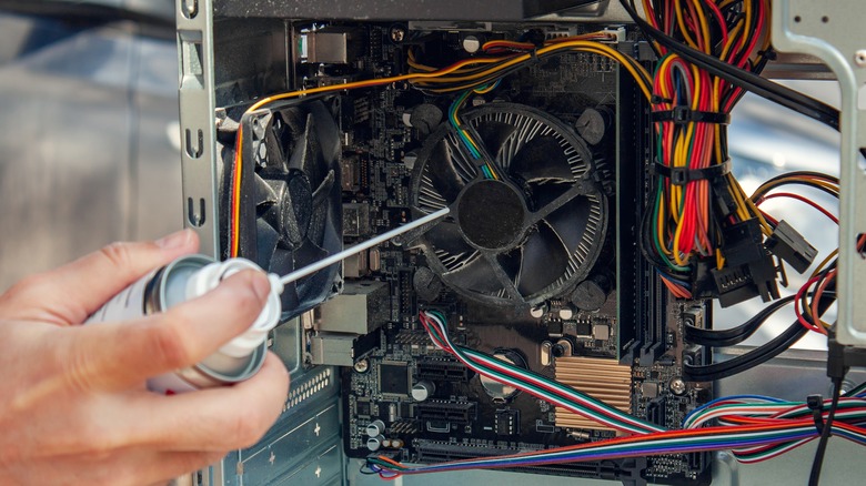 Cleaning out laptop fan with compressed air can