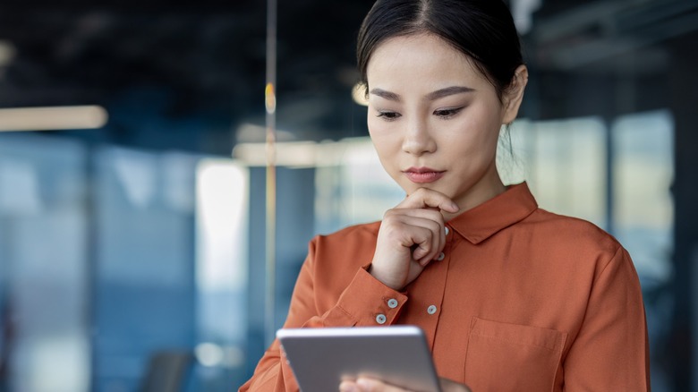 Woman reading from a tablet device