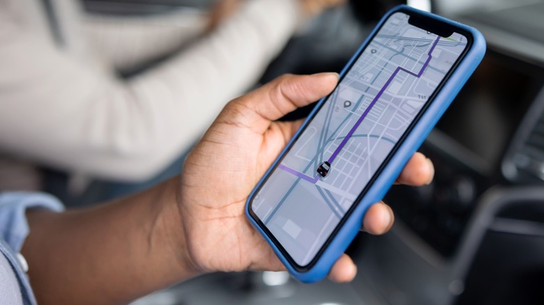 Person tracking Uber ride on smartphone