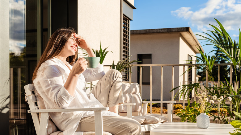 woman having coffee on patio