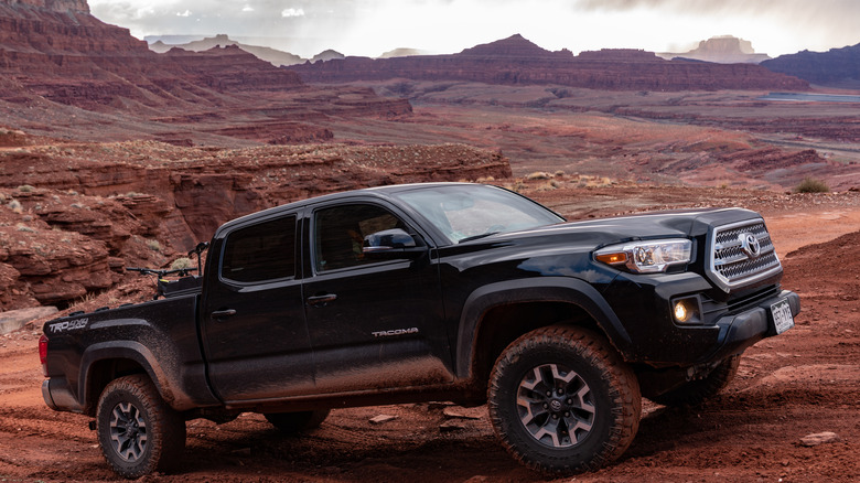 Black Toyota Tacoma going off-road