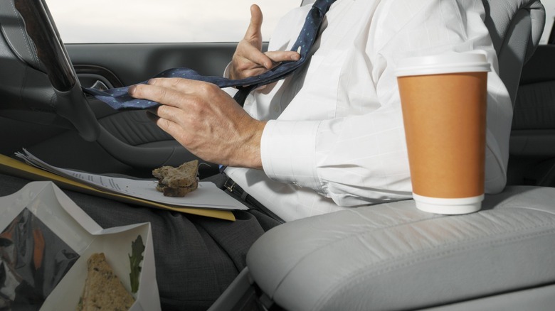 person eating in car