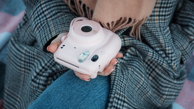 Person holding an Instax Mini 11