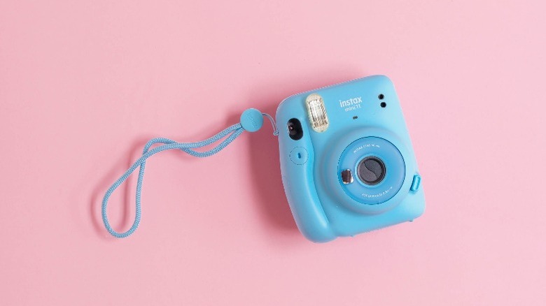 Blue Instax Mini 11 camera