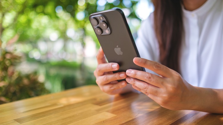 Woman holding iPhone