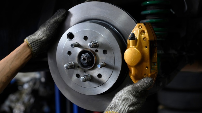 Brake caliper being installed