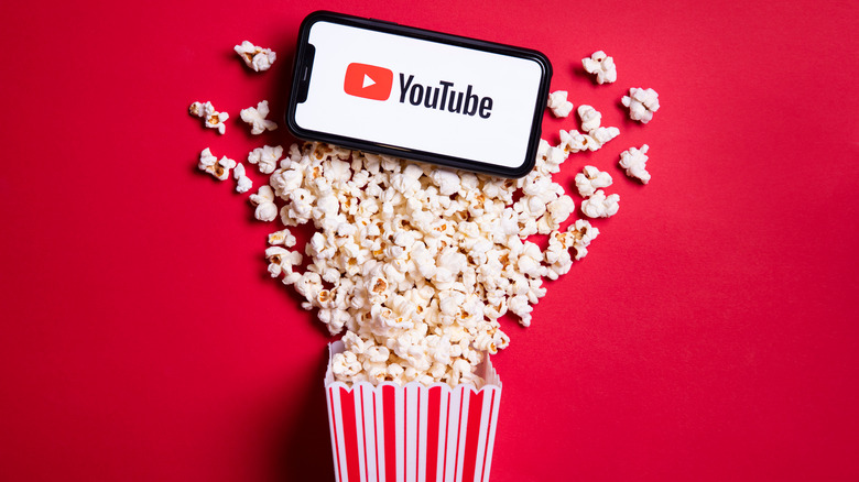 Smartphone with YouTube and popcorn