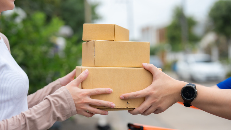 Delivery person handing off package