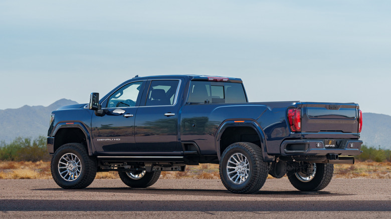 A GMC Sierra Denali HD pickup truck with its tailgate closed.